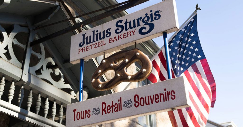 Store front sign and flag at Julis Sturgis Bakery